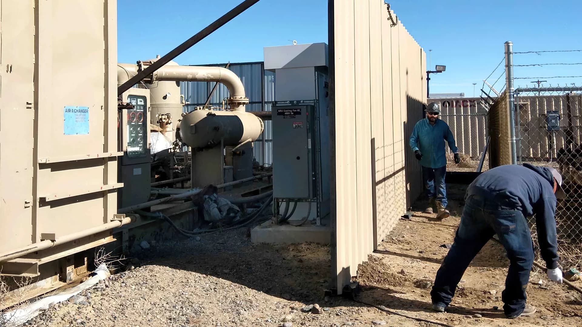 Roustabout building tank battery